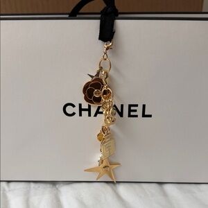 CHANEL Gold Camellia & Star Perfume Bottle Charm Keychain